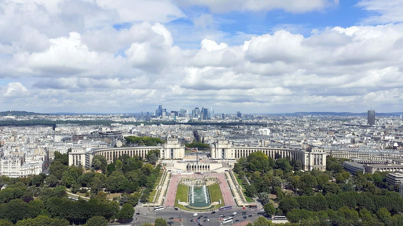 Paris seen from the Eiffel Tower, with the towers of La Défense on the horizon